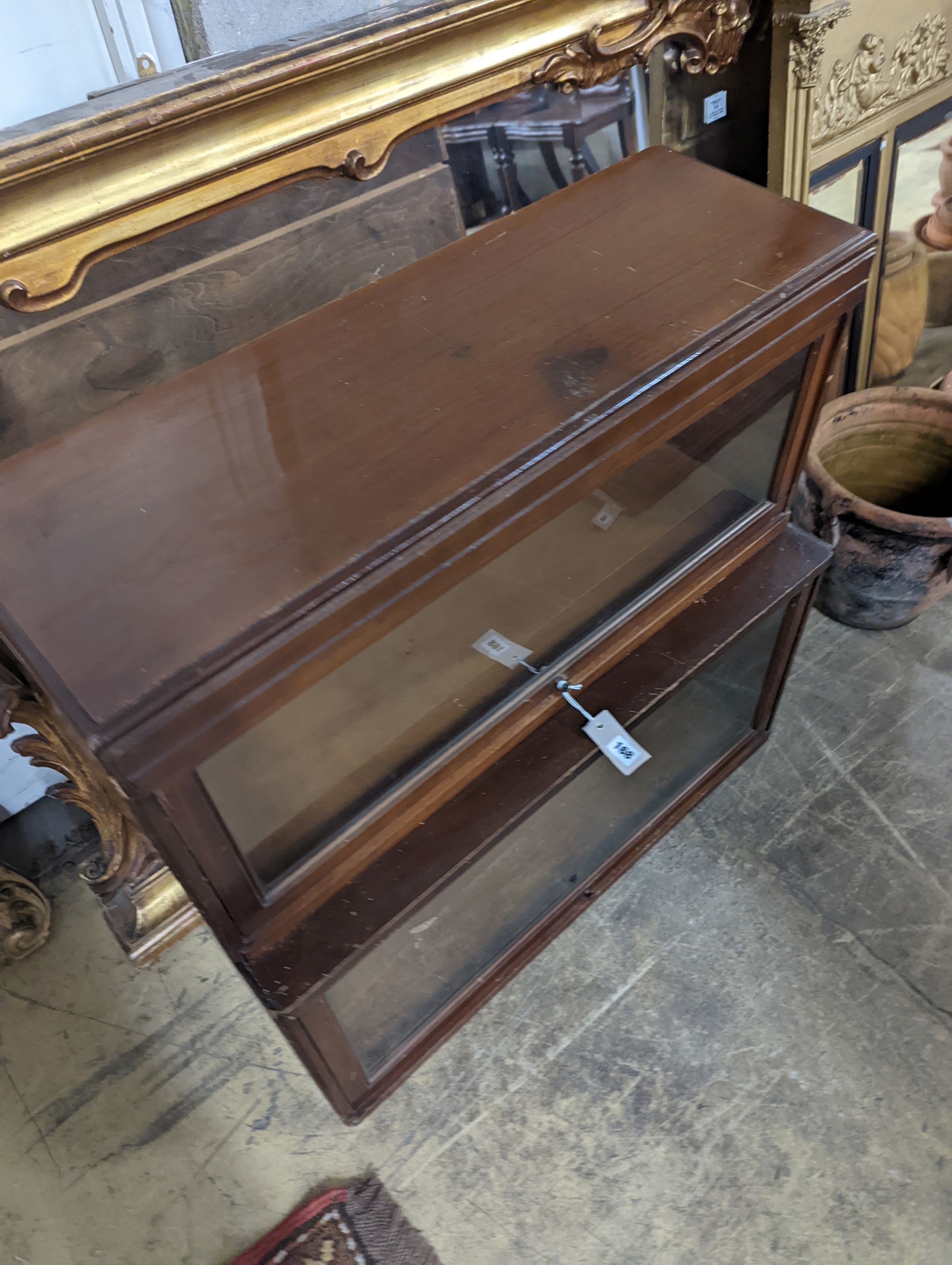 A Globe Wernicke mahogany two section bookcase, width 85cm, depth 36cm, height 80cm (wormed)